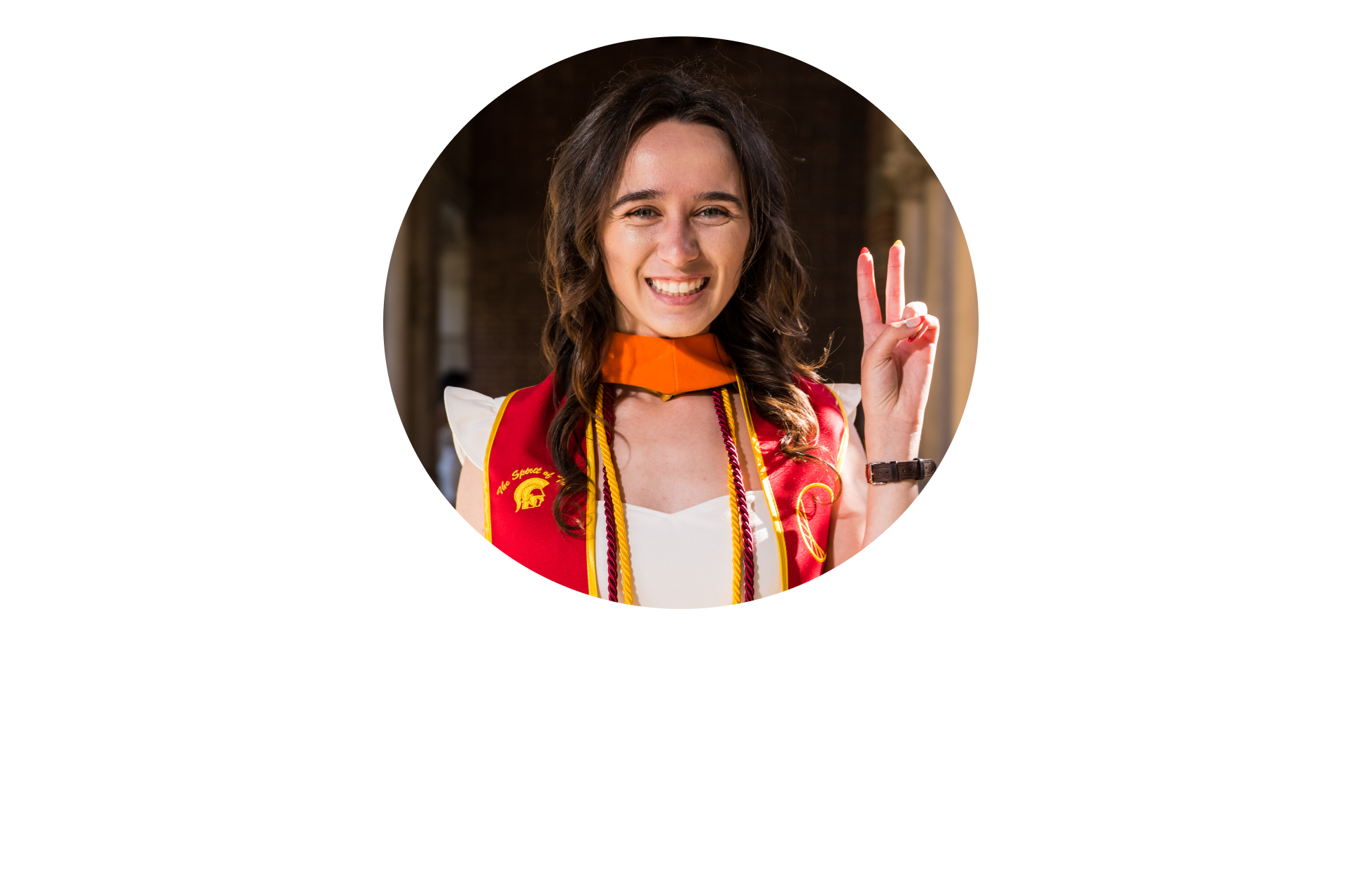 Megan wearing her undergraduate USC sash and orange master's hood with a Fight On! peace sign